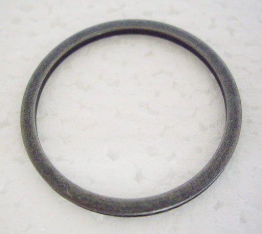A black ring is sitting on the floor