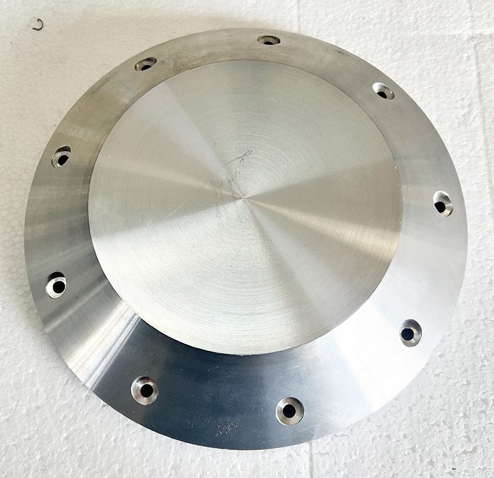 A metal plate with holes on it