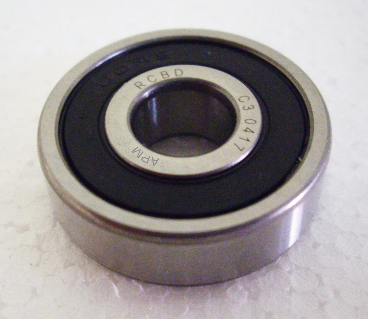A ball bearing with one side missing.