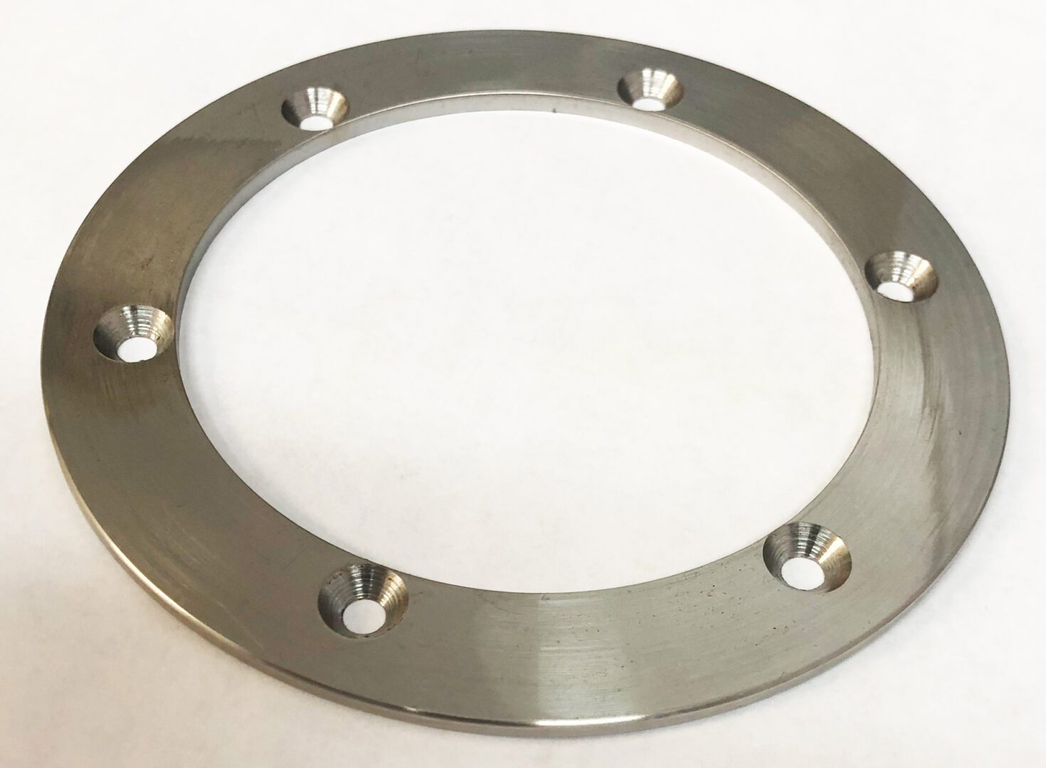 A metal ring with holes for the top of it.