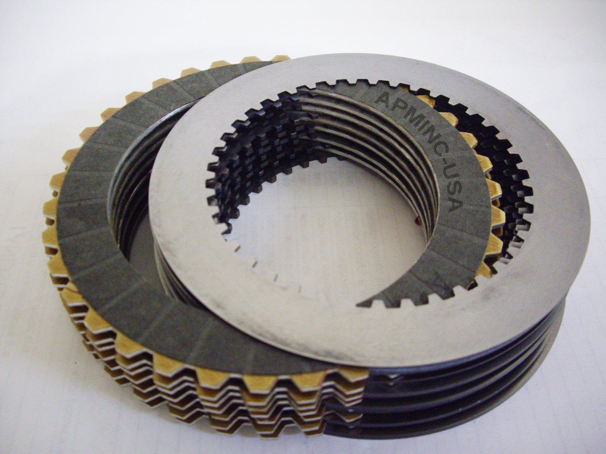 A stack of metal plates with different shapes and sizes.