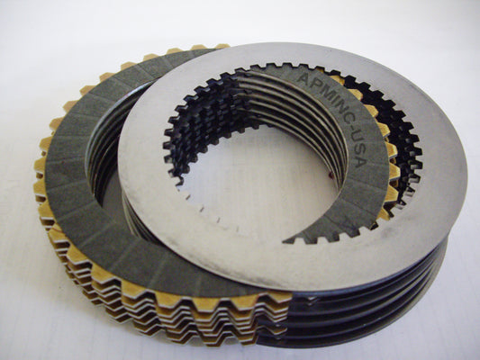 A stack of metal plates with different shapes and sizes.