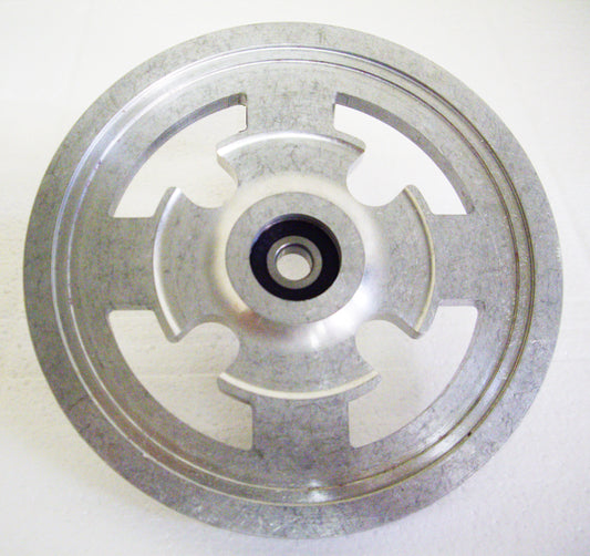 A metal wheel with a black center ring.