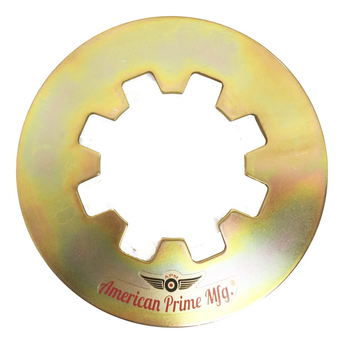 A gold colored disc with an image of a gear on it.