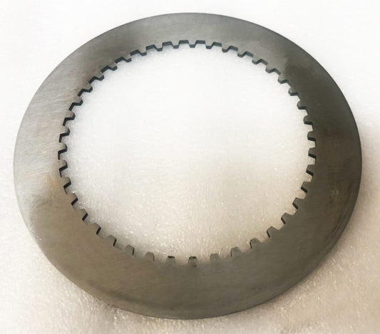 A close up of a metal disc on top of a table