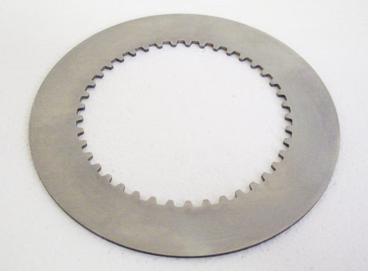 A close up of a disc brake on a white surface