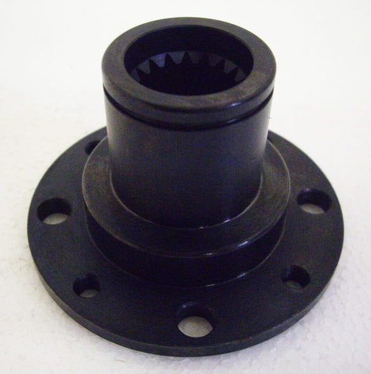 A black plastic part sitting on top of a table.