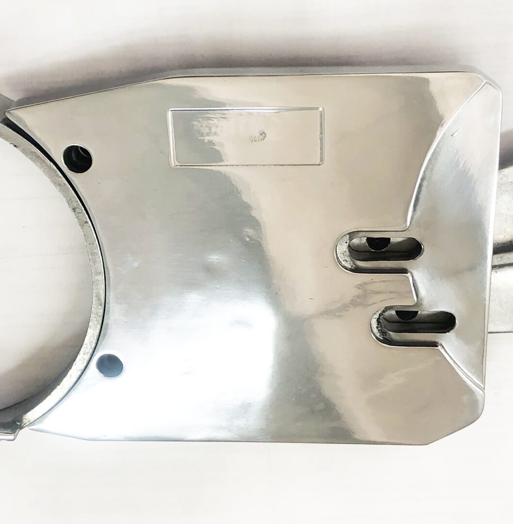 A metal object with two holes in it.