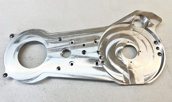 A metal piece of art that is made to look like it has been cut out.