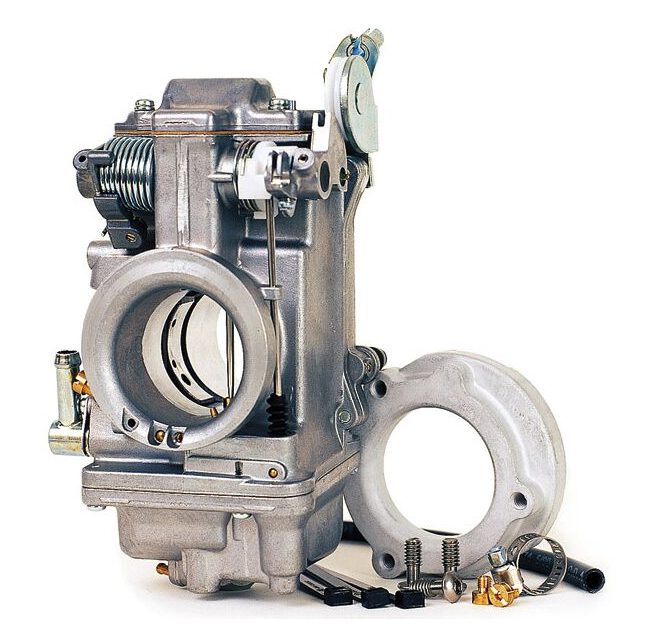 A close up of an engine with the carburetor removed