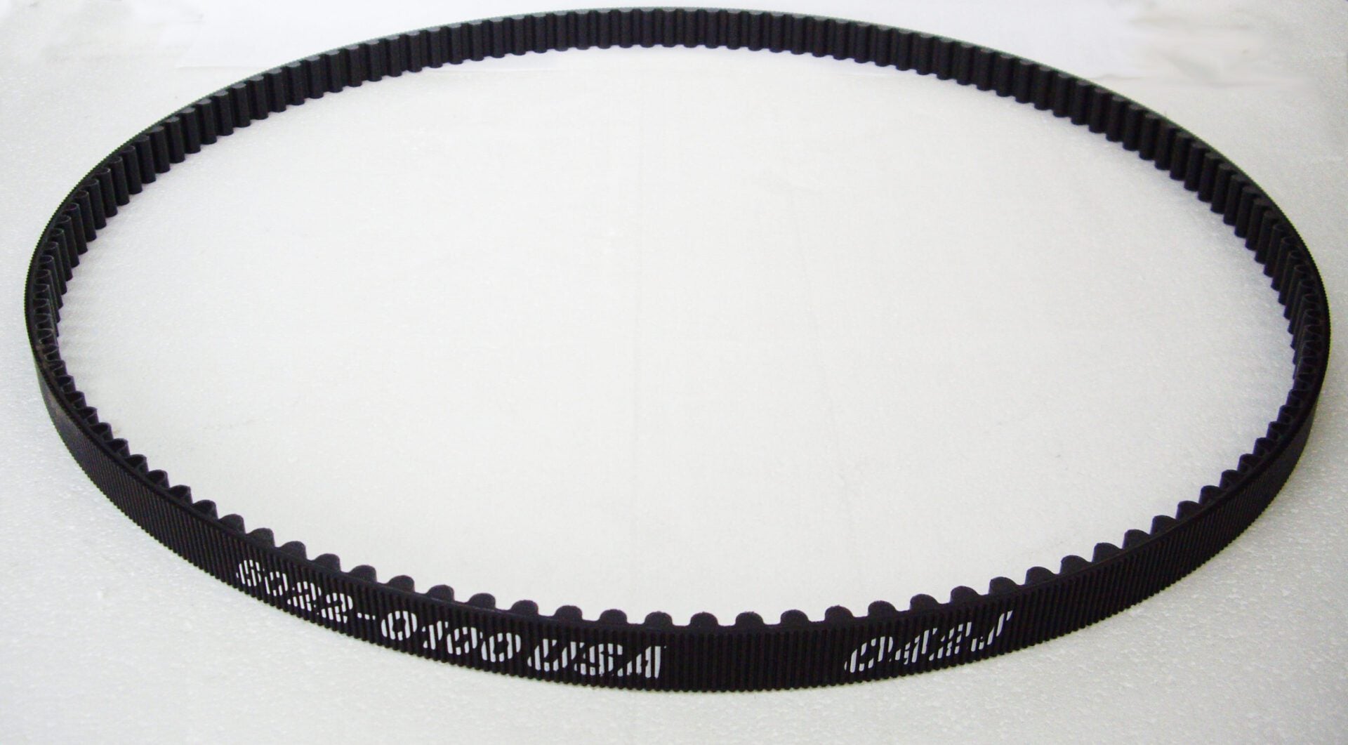 A belt that is black and has words on it.