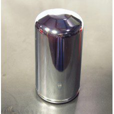 A chrome can sitting on top of a table.